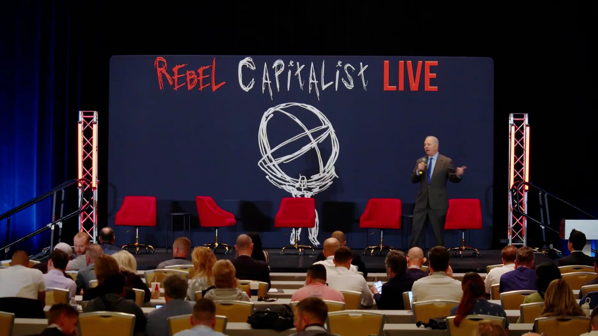 Rebel Capitalist Orlando – “Who is Running the World? Answers Here”